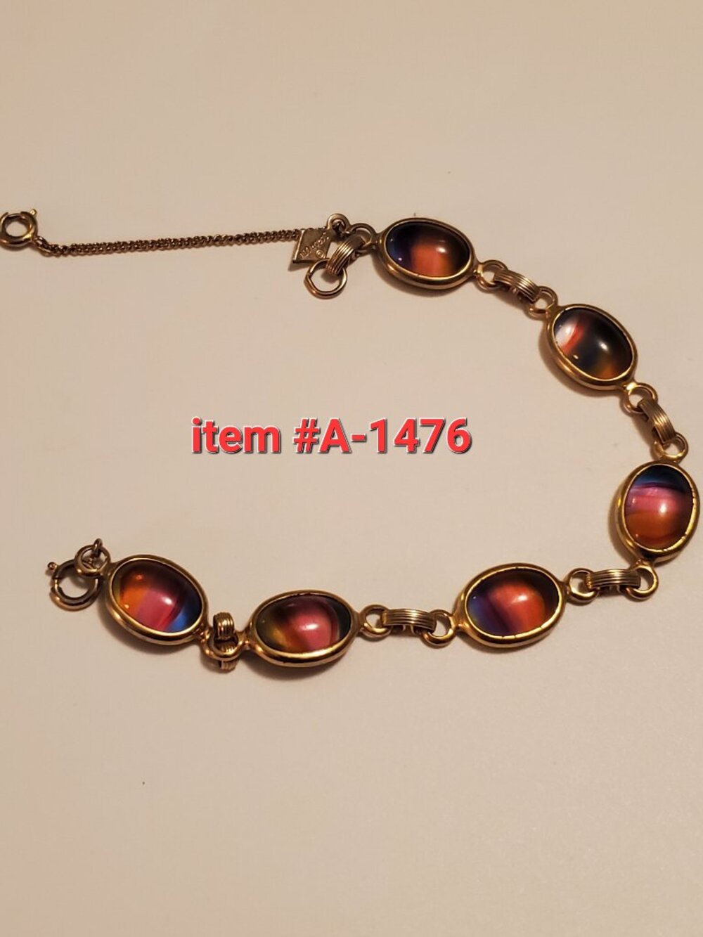 1 Bracelet ,gold link with gem stones, item # A -1476, . wt . 12 grams.